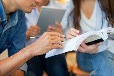 Pictured: A small group looking at an open manual.