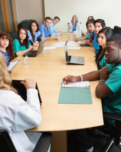 Healthcare professionals meeting around a large table