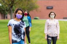 Three students wearing masks