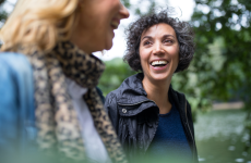 Two people walking through community