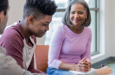 Professional smiling at youth