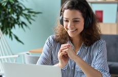 Engaged person watches presentation on laptop