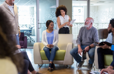 People in an office discussing