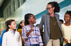 Photo of teacher walking with students