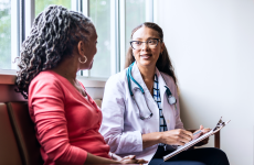 Health professional speaking to patient