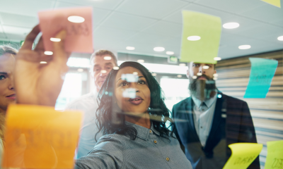 Photo of colleagues working with sticky notes