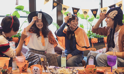 Youth play a party game during Halloween