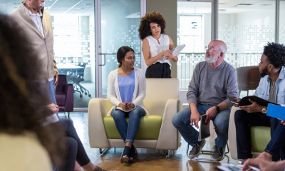 People in an office discussing