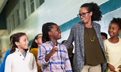 Photo of teacher walking with students