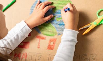 Child drawing the earth