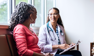 Health professional speaking to patient