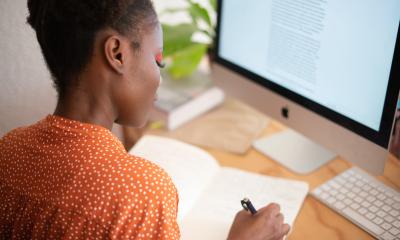 Woman writes a grant