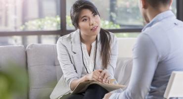 Therapist talking with client