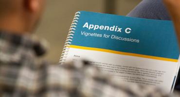 Pictured: A close photo of the AMSR spiral-bound manual