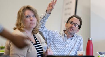 Healthcare professional listening during meeting