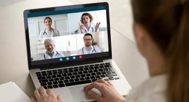 Person on a computer on a consultation 