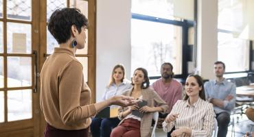Educator leading meeting
