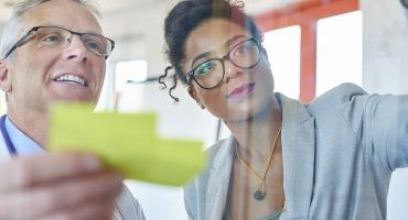 Professionals using sticky notes