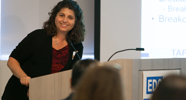 Smiling person giving a speech