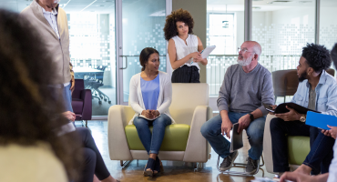 People in an office discussing