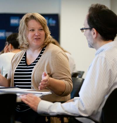 Healthcare professionals talking at a training