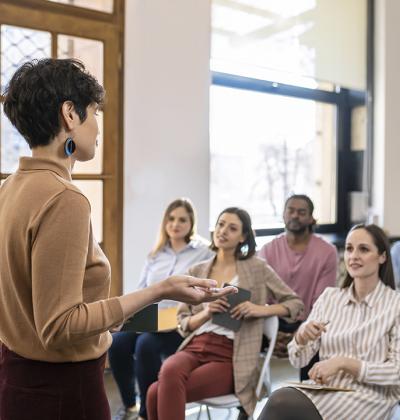 Educator leading meeting