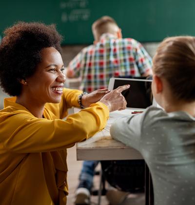 Teacher working with young student
