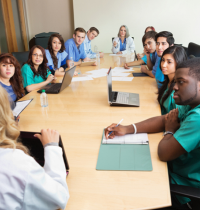 Healthcare professionals meeting around a large table