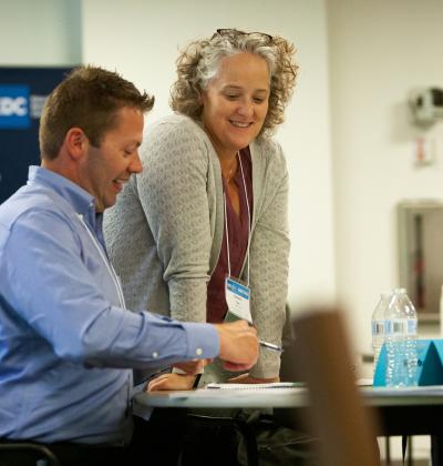 Trainer speaks with training participant