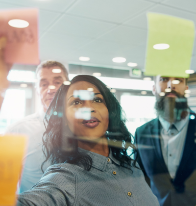 Photo of colleagues working with sticky notes