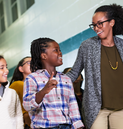 Photo of teacher walking with students
