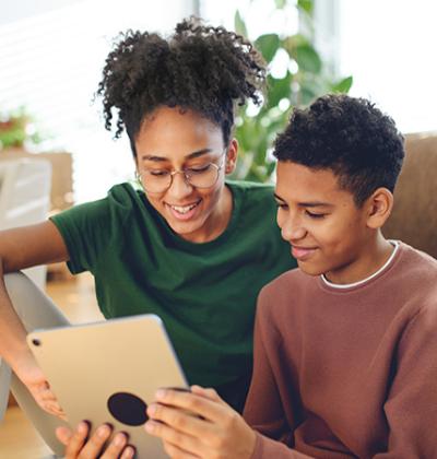 Two youths looking at a tablet