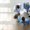 Pictured: A circle of healthcare workers viewed from above