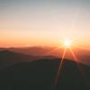 Sun rising over mountains