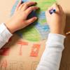 Child drawing the earth