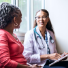 Health professional speaking to patient